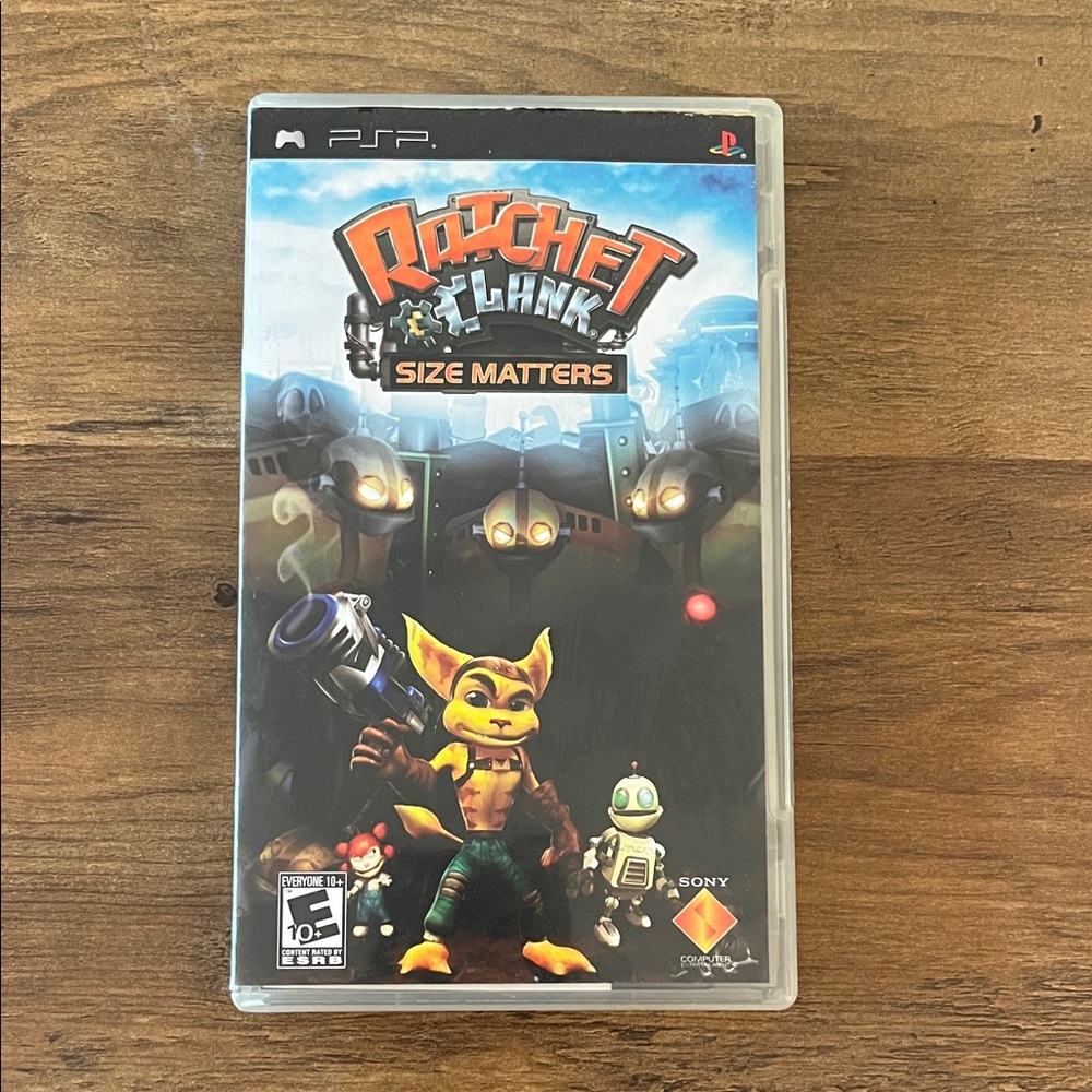 Sony PSP Game - Ratchet & Clank: Size Matters with Black and Orange Cover